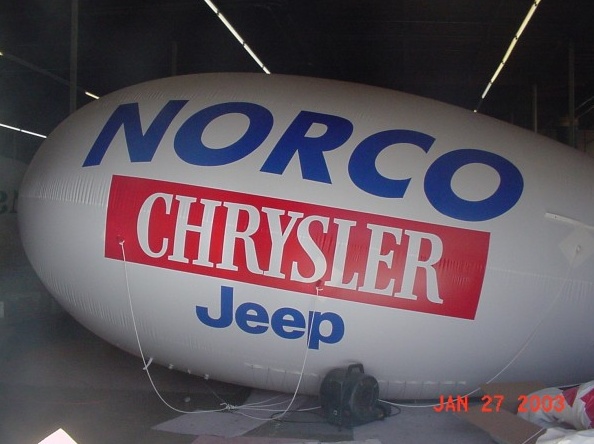 White Blue Advertising Norco Chrysler Jeep Blimp